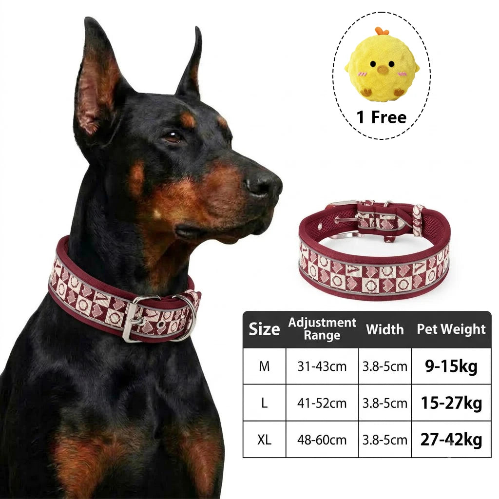 Black dog harness with reflective trim and a yellow plush toy included