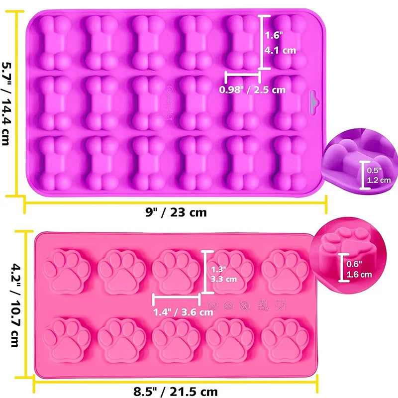 A set of pink silicone molds shaped like dog paws and bones for making treats
