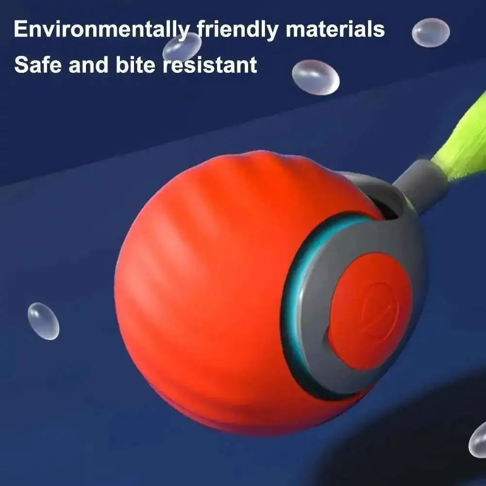 A close-up of an orange interactive motion cat toy with a green faux tail, highlighting its bite-resistant and environmentall