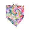 A square bandana featuring a vibrant watercolor spiral pattern of pink, green, and purple hues.