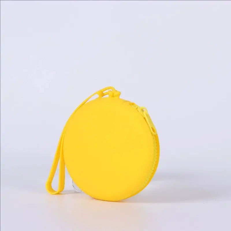 A bright yellow silicone pet treat pouch for training and travel.