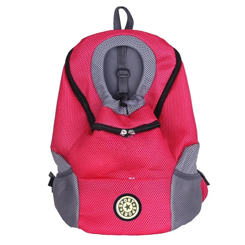 A bright pink ventilated pet carrier backpack with a gray lining and black trim.
