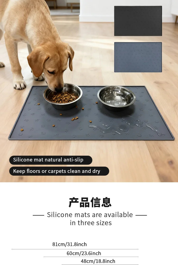 A dog is eating from a dark silicone pet feeding mat placed on a wooden floor.