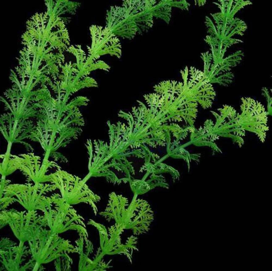 A close-up of artificial aquarium plant with soft silicone green leaves.