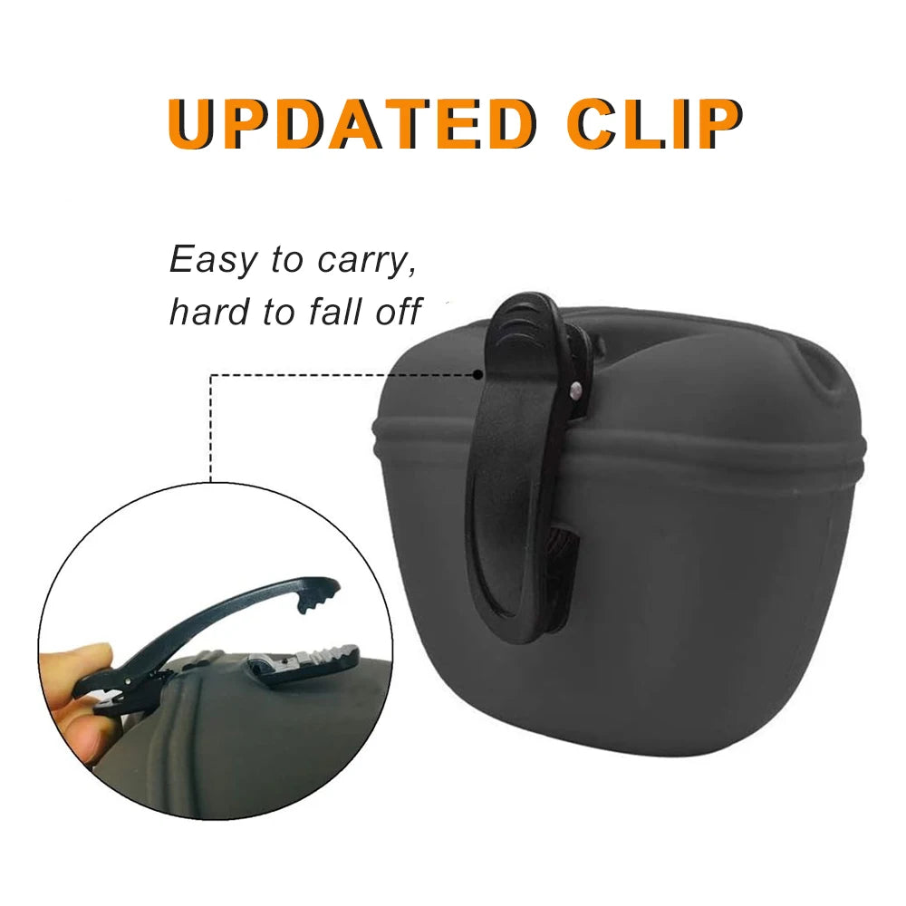 A dark gray silicone dog treat pouch with a magnetic closure and a strap for carrying.