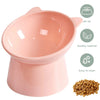 A pink pet feeding bowl with a tilt feature, highlighting healthy material and ease of cleaning.