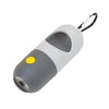 A white and gray capsule dog waste bag dispenser with a black handle and LED flashlight.