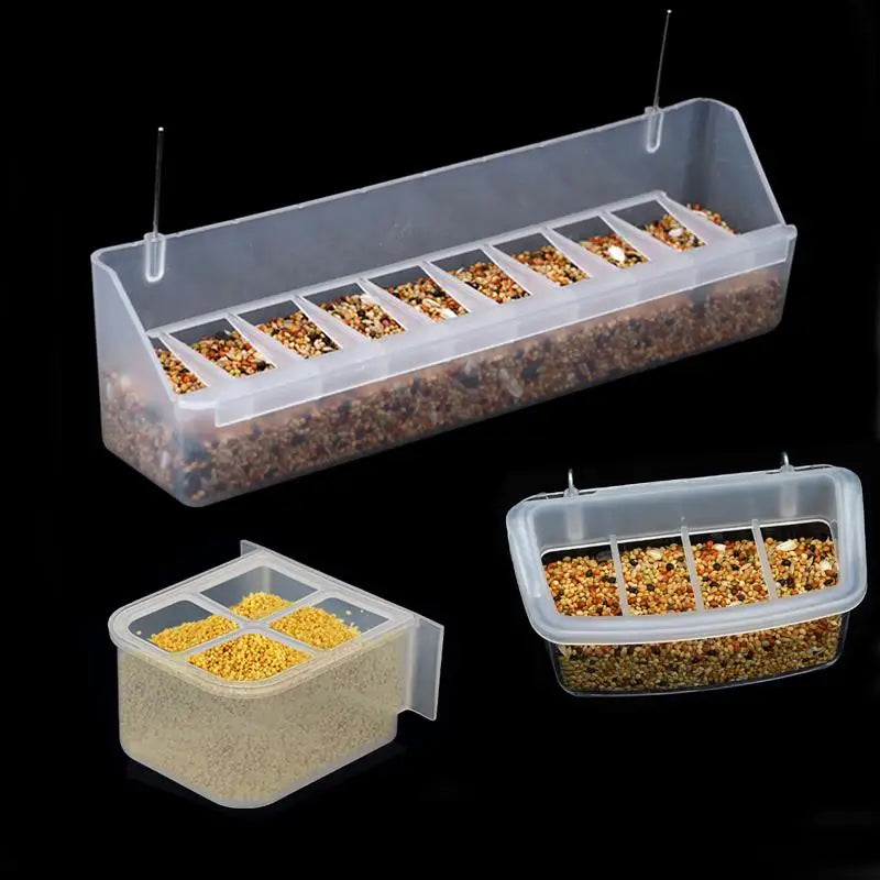 Clear plastic feeder tray with multiple compartments holding bird seed and water.