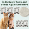 A cat sitting next to individually packaged sealed pads and a white dish for a litter box deodorizer gel product.