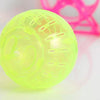 A transparent lime green hamster exercise ball resting on a white surface.