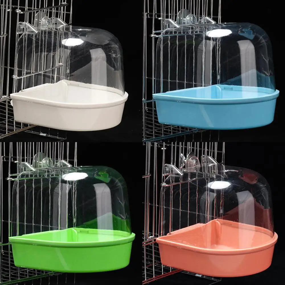 Four variations of clear hanging bird baths in white, blue, green, and orange displayed in wire cages.