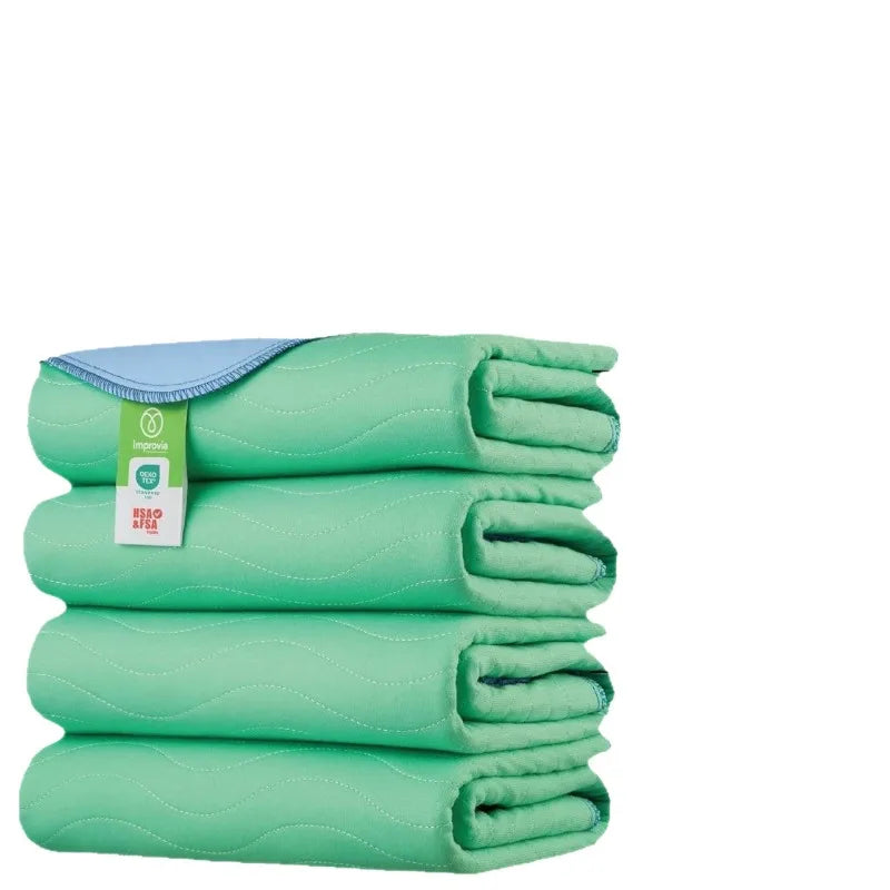A stack of light green reusable waterproof pet training pads.