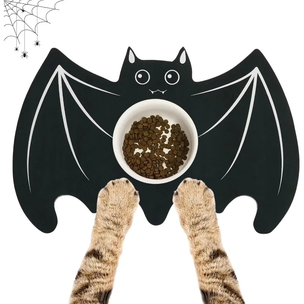 A black bat-shaped Halloween pet feeding mat with a spider web design and cat paws underneath.