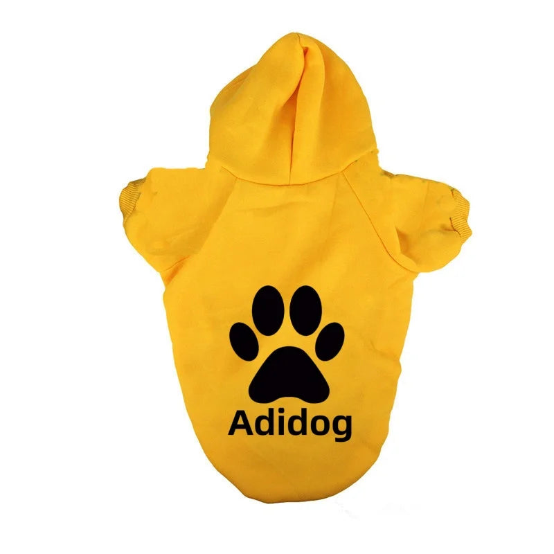 Yellow Adidas dog-themed hoodie sweatshirt with a black paw print design