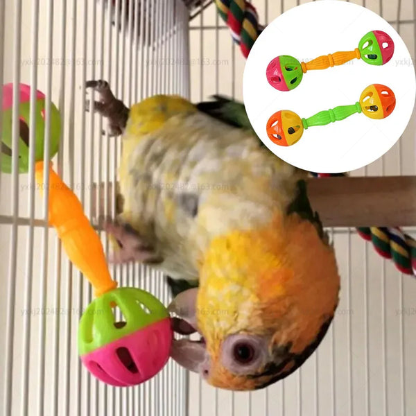 A parrot is interacting with an interactive bell toy designed for birds.
