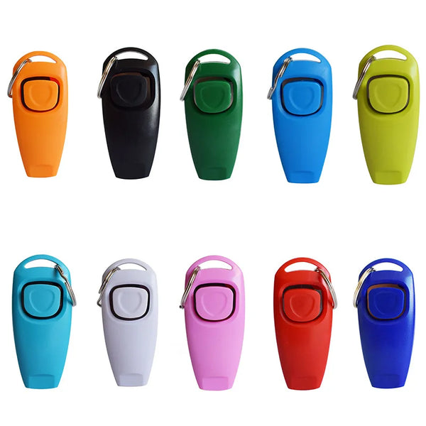 A collection of ten brightly colored dog training clickers and whistles in various shades including orange, black, green, blu