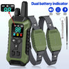 A dual battery indicator remote control dog training collar with green and black components and straps.