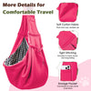 A bright pink reversible hands-free dog sling carrier bag shown with details of the soft cotton fabric and storage pocket.