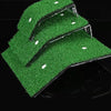 A green grass ramp platform with suction cups is shown against a black background.