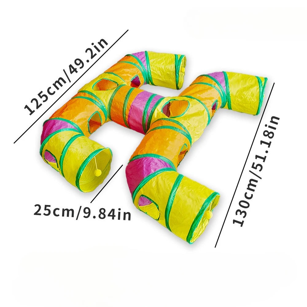 A colorful, flexible rainbow cat tunnel with multiple entrances shown lying down.