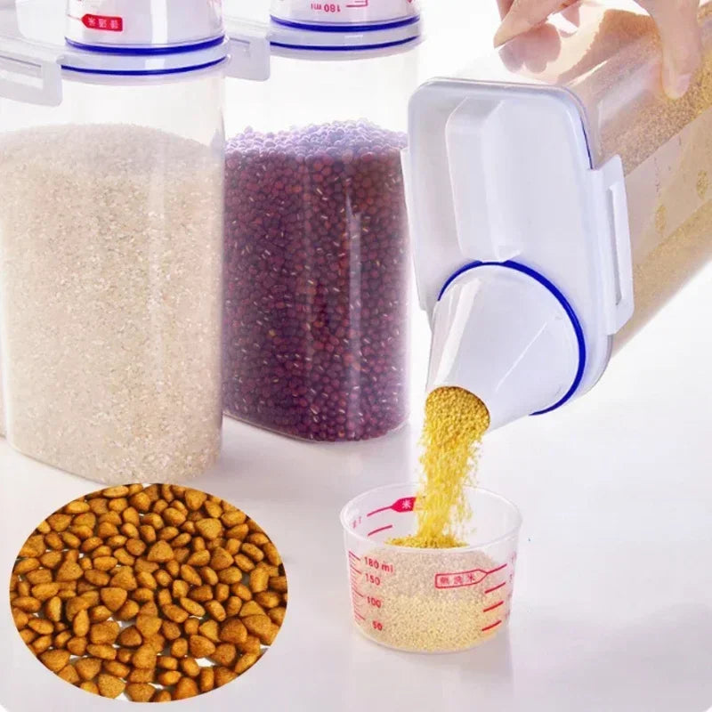 A white pet food storage container is shown with various colored kibble and a measuring cup filled with yellow kibble.