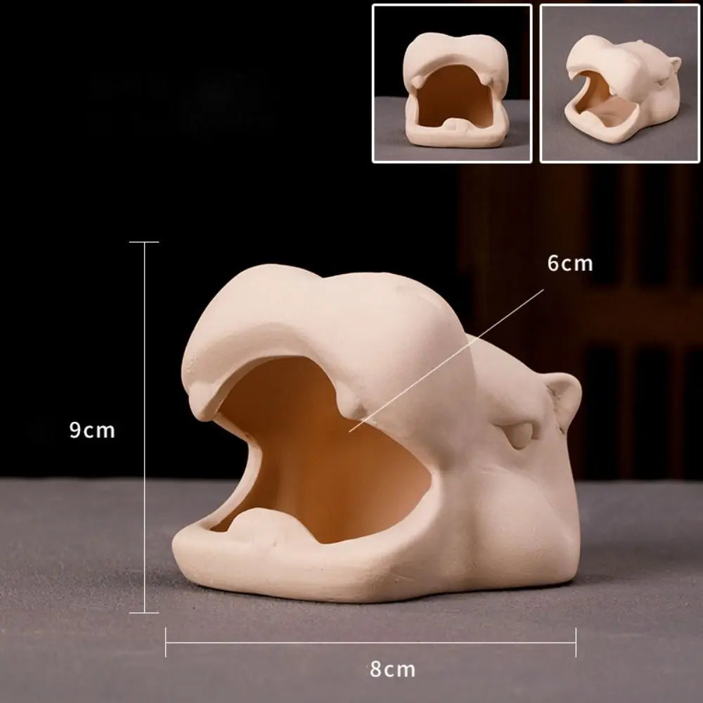 A beige ceramic aquarium shrimp hideaway cave with an entrance, shown from the side and top views.