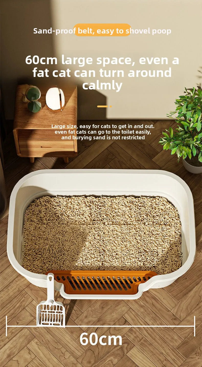 A large white semi-enclosed cat litter box with an orange grate and loose litter, shown next to a measuring line.