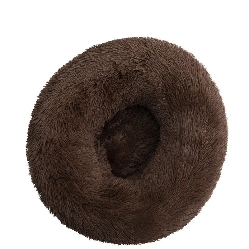 A round, dark brown plush pet bed with a thick, fuzzy texture.