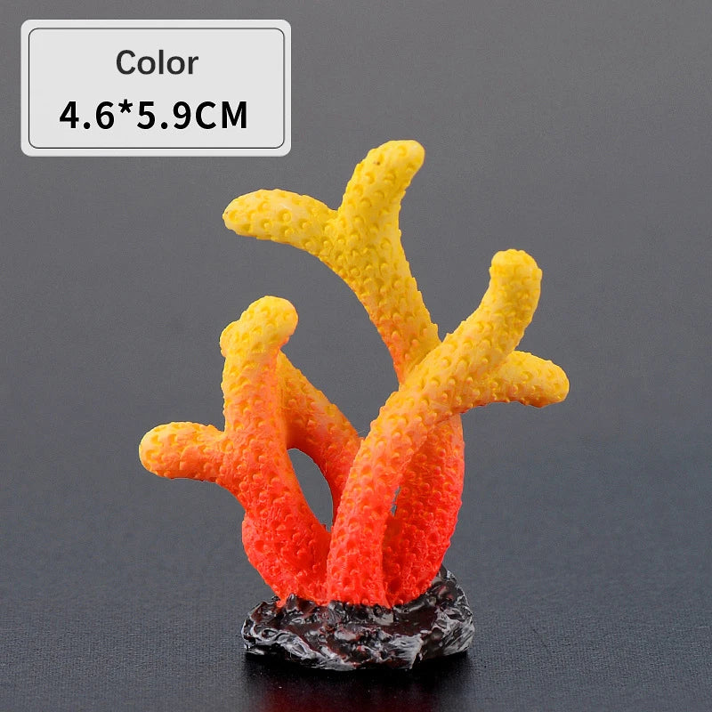 A bright orange and yellow resin coral decoration with a textured surface mounted on a dark base.