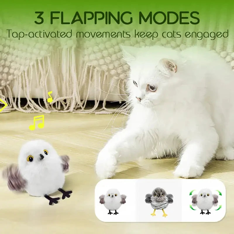 A white cat is interacting with a flapping bird toy designed to keep cats engaged.