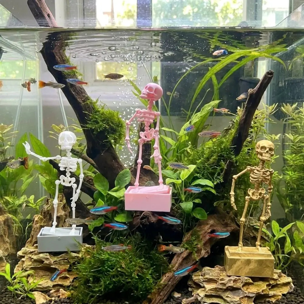 A detailed diorama featuring a dancing skeleton figure and various aquatic plants in a glass tank.