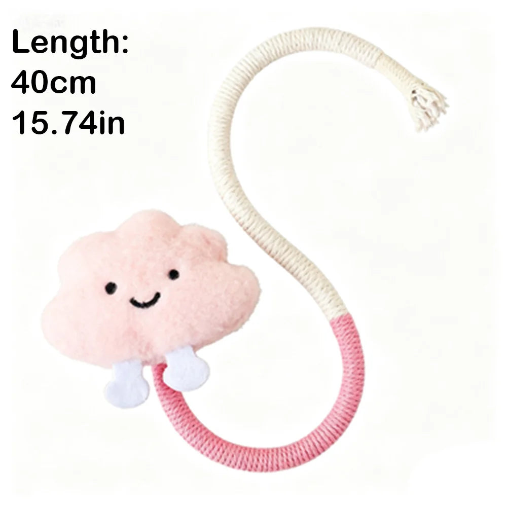 A pink cloud-shaped cotton rope toy with a white cord and silvervine fruit attached.