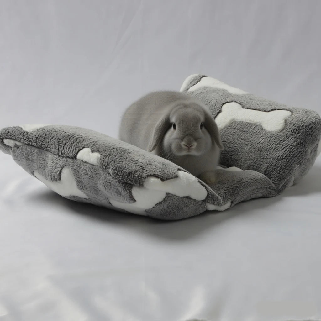 A plush rabbit bed featuring a star pattern and a recliner pillow, resting on a white surface.