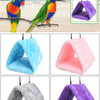 A purple plush hanging bird hammock bed for a parrot.