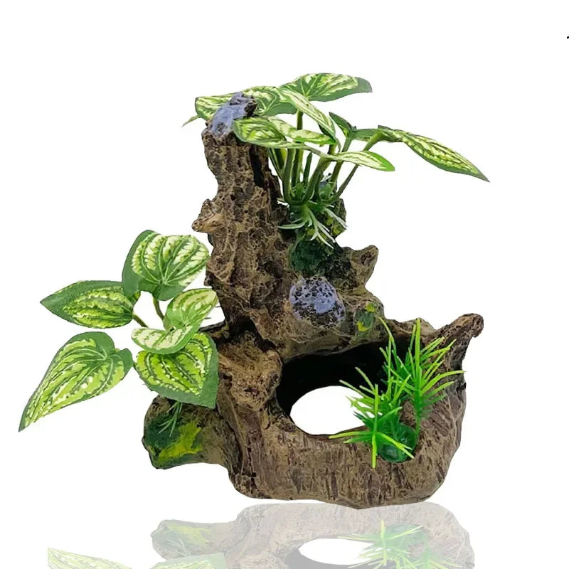 A realistic plastic plant arrangement featuring green leaves and purple accents secured in a natural wood-like base for aquar