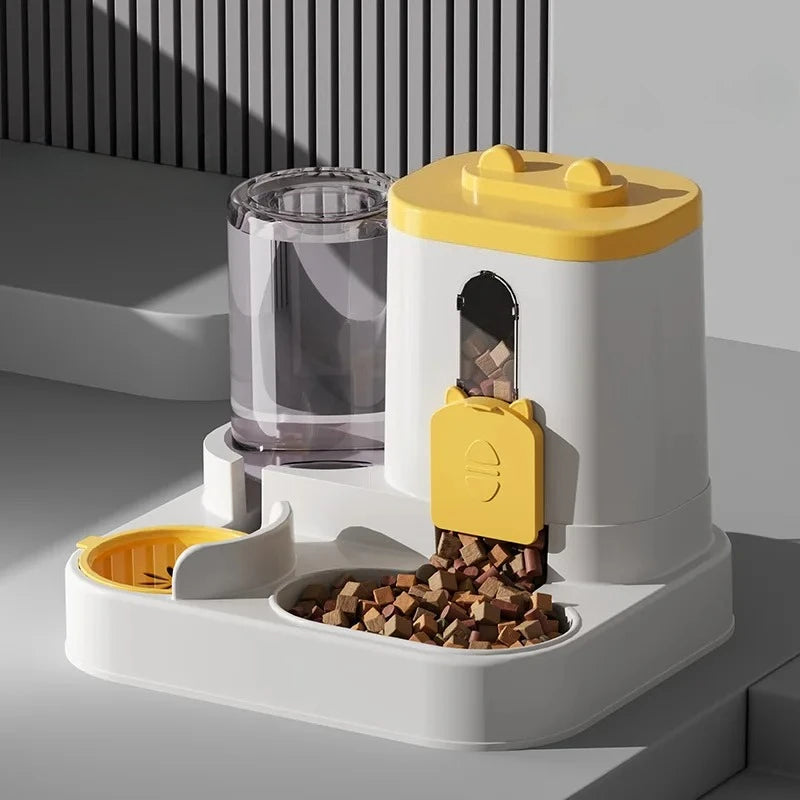 A white gravity pet food and water dispenser with a yellow lid, holding kibble and water.