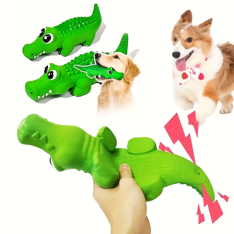 Green crocodile-shaped latex dog chew toy with a squeaker next to a dog.
