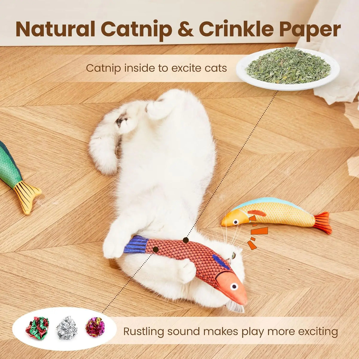 A white cat plays with a fish toy made from catnip and crinkle paper on a wooden floor.