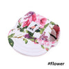 A pink floral print visor cap featuring a silhouette of a dog on the front.