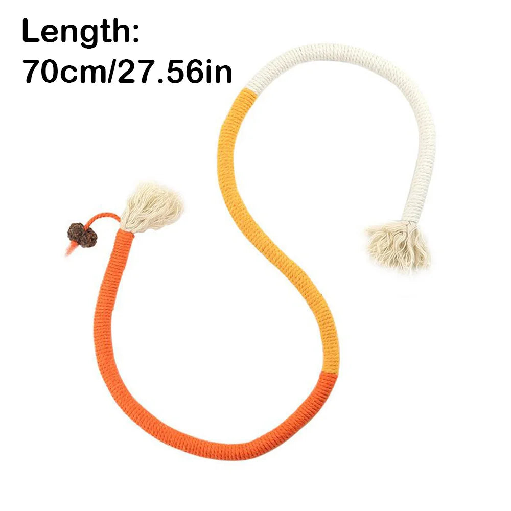 Orange and cream cotton rope cat toy with a silvervine fruit charm