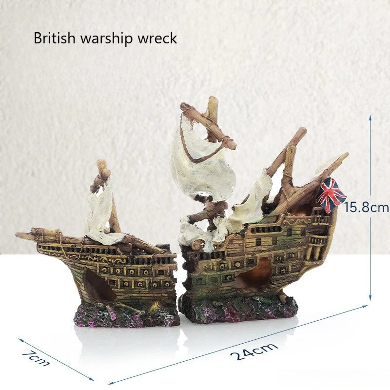 A model of a British warship wreck with a cave hideout for fish tanks, featuring weathered wood and rigging.
