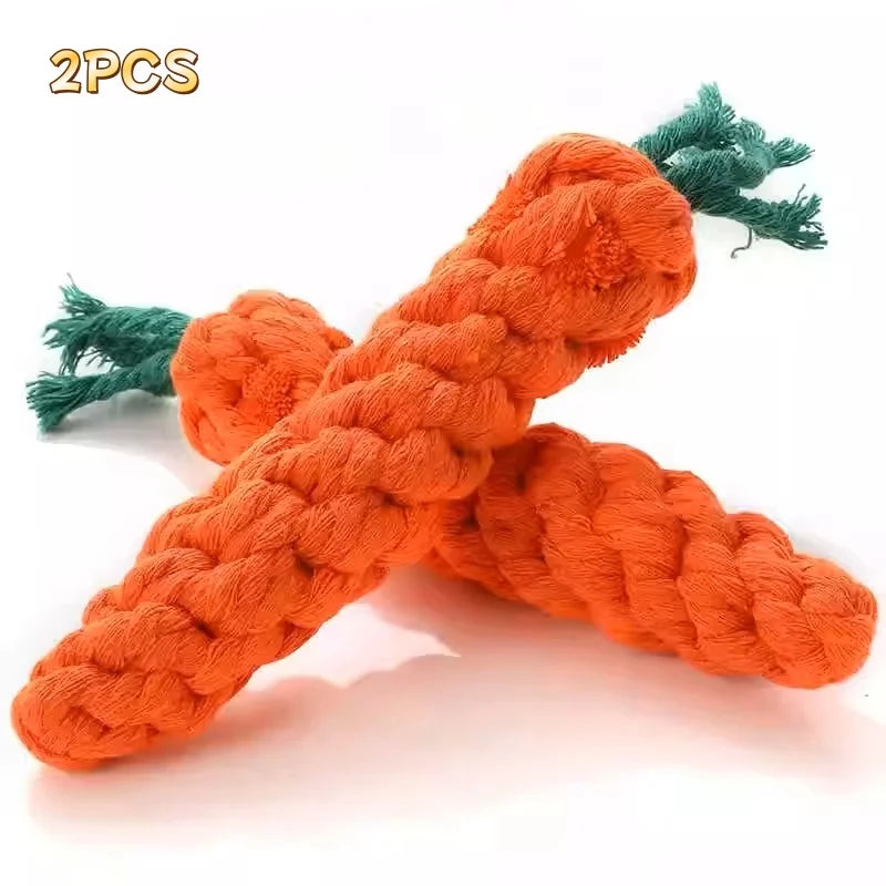 Two orange carrot plush toys with green leafy tops for cat teething and scratching