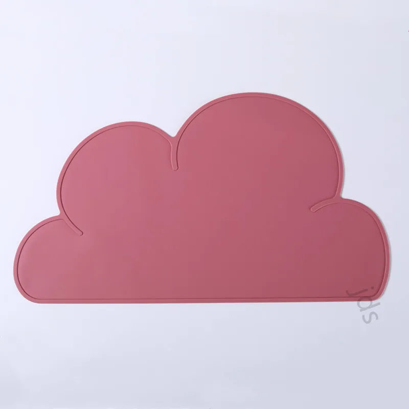 A pink, cloud-shaped silicone pet feeding mat.