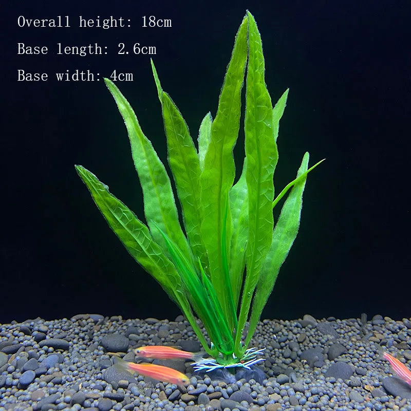 A vibrant green artificial aquarium plant with long leaves is rooted in dark gravel.