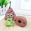 A brown silicone dog waste bag dispenser shaped like a dog head with large eyes and a green bag resting on a woven mat.
