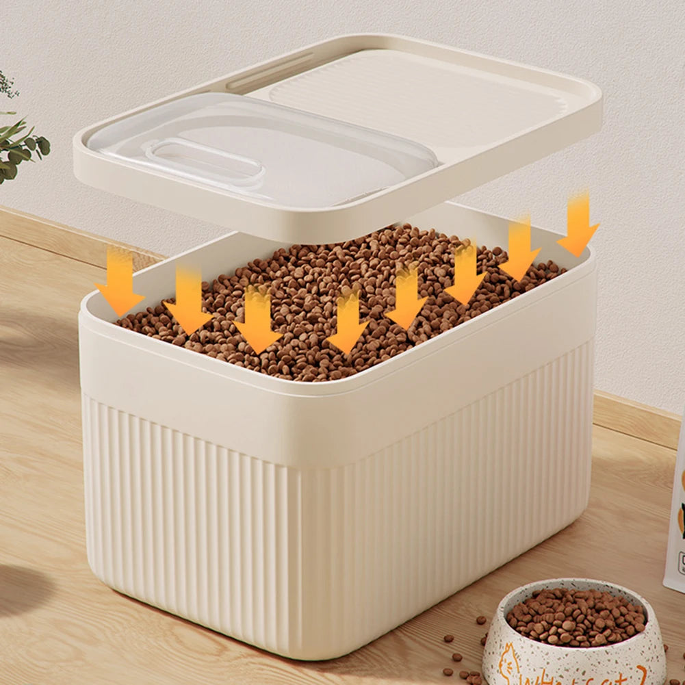 A white airtight pet food storage container with a lid is shown, filled with brown pet food pellets.
