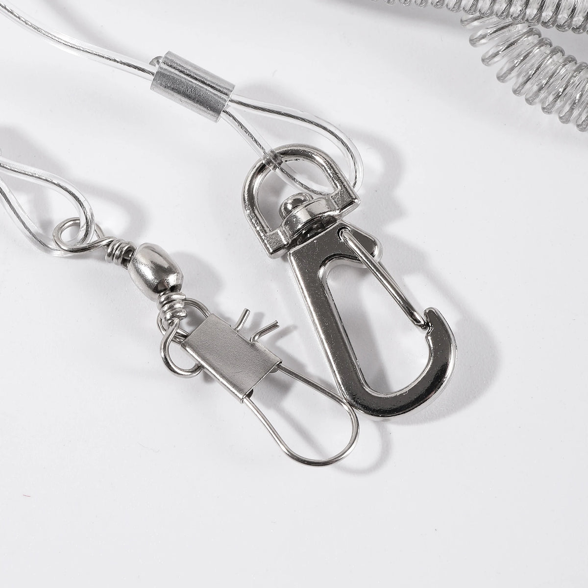 Silver stretch bird flying leash with a clip and a loop attached to a thin wire.