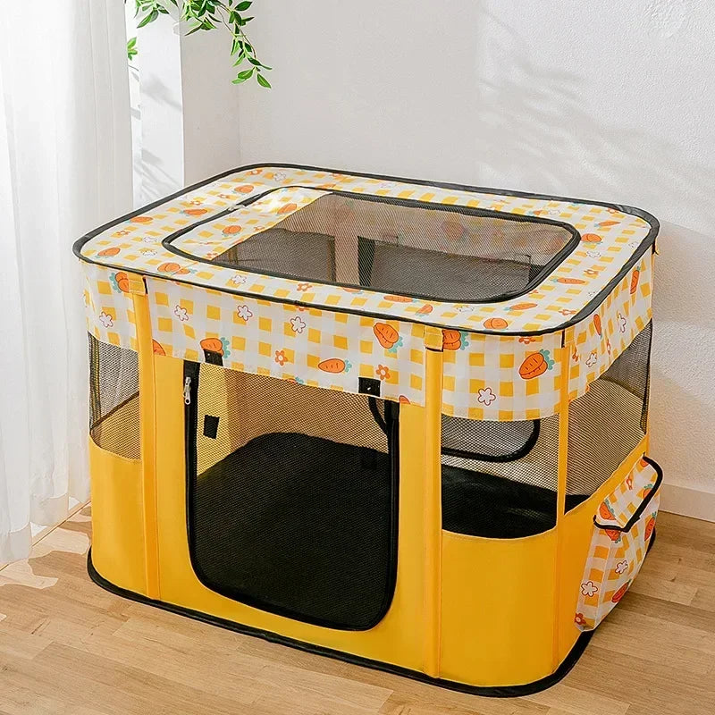 A yellow folding cat tent bed with a clear plastic top and mesh sides sits on a wooden floor.