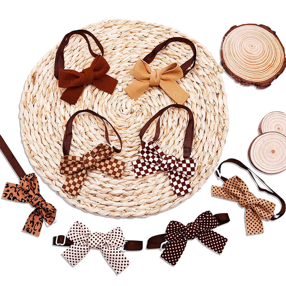 A collection of pet bow ties featuring plaid, polka dot, and solid patterns for dogs and cats displayed on a woven mat.