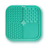 A teal silicone pet licking mat with suction cups divided into four sections for slow feeding